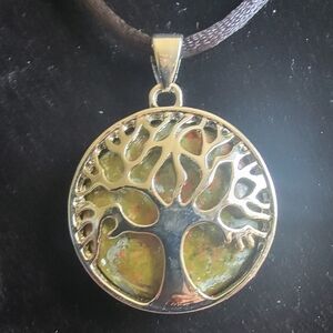 Unakite And Silver tree of life necklace on a satin string with hook closure.
